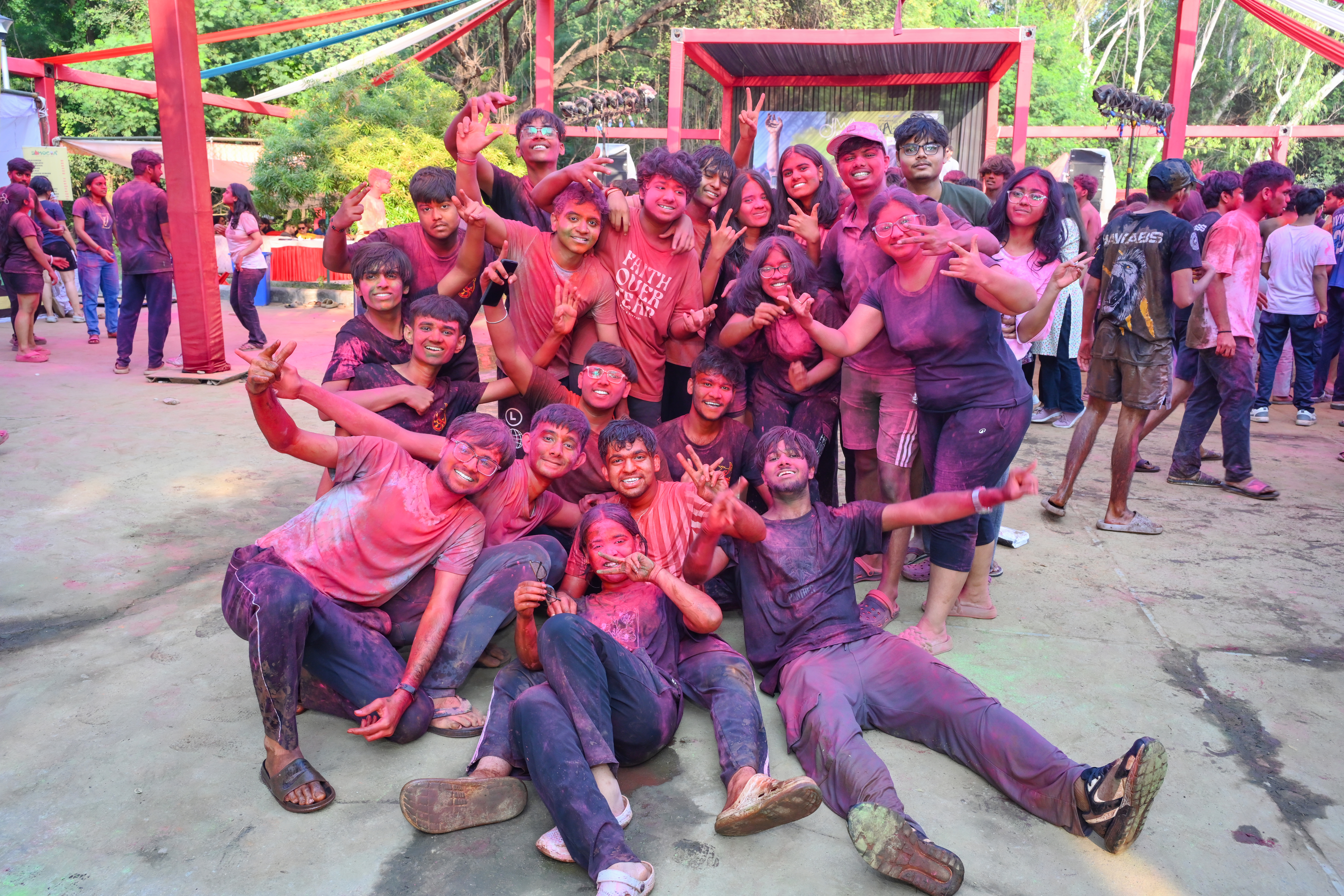 A group of people sitting on a blue surface

AI-generated content may be incorrect.